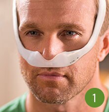 man wearing sleep apnea mask