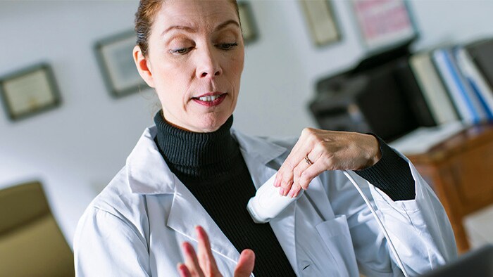 Patient being examined with Lumify handheld ultrasound